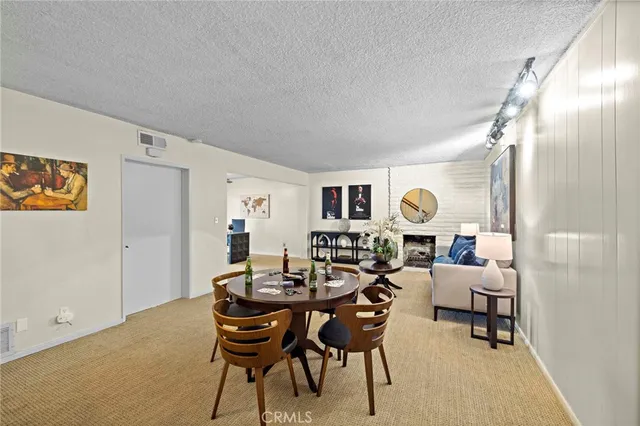 a living room with furniture and a mirror