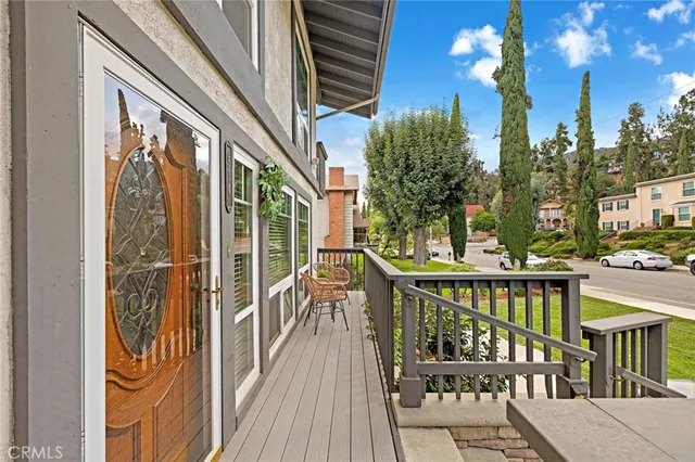 a view of a balcony with chairs