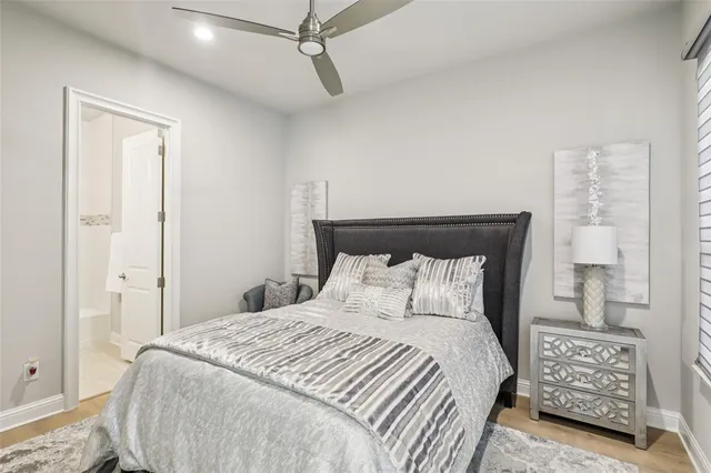 a bedroom with a bed and a night stand