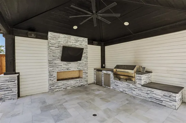 a view of a porch with furniture and a fireplace