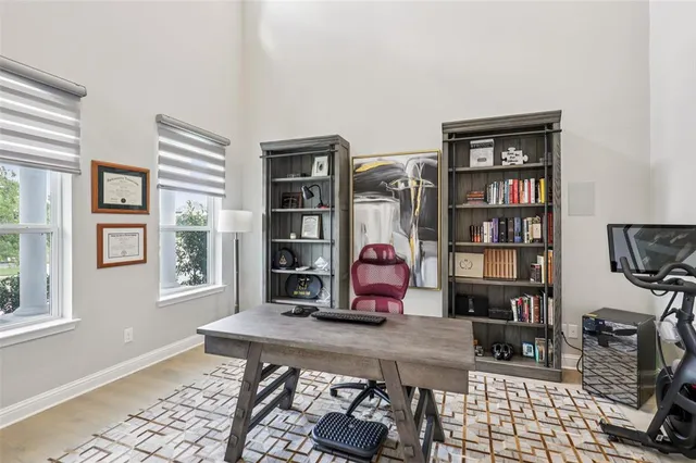 a room with bookshelf and a window