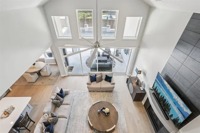 a view of living room with furniture and a fireplace