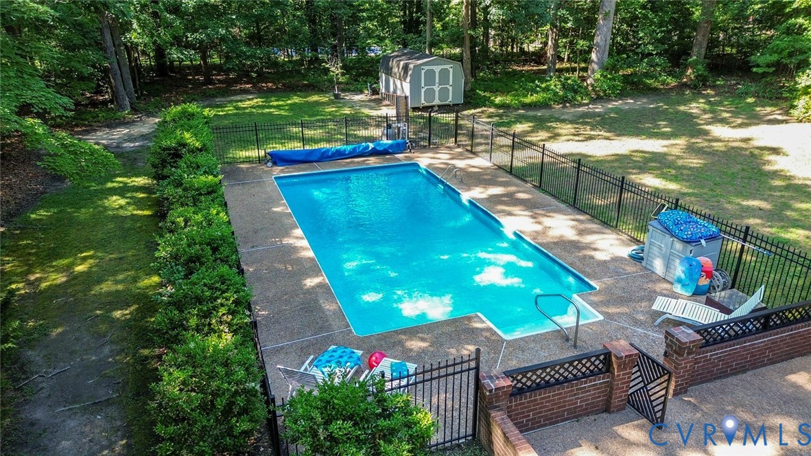10716 Chalkley Road Richmond, VA 23237 - Photo 6 of 46 a view of a backyard with couches plants and large trees