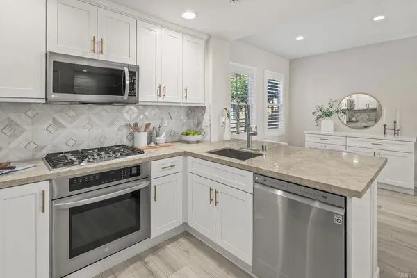 a kitchen with a stove and a microwave