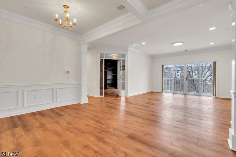 7204 Westover Way, Unit 7204 Somerset, NJ 08873 - Photo 5 of 43 a view of an empty room with wooden floor and windows