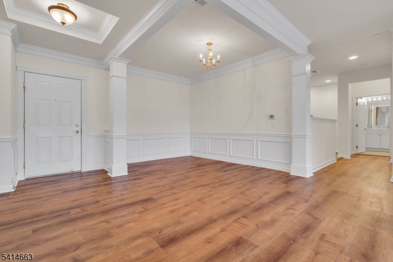 7204 Westover Way, Unit 7204 Somerset, NJ 08873 - Photo 6 of 43 wooden floor in an empty room with a chandelier