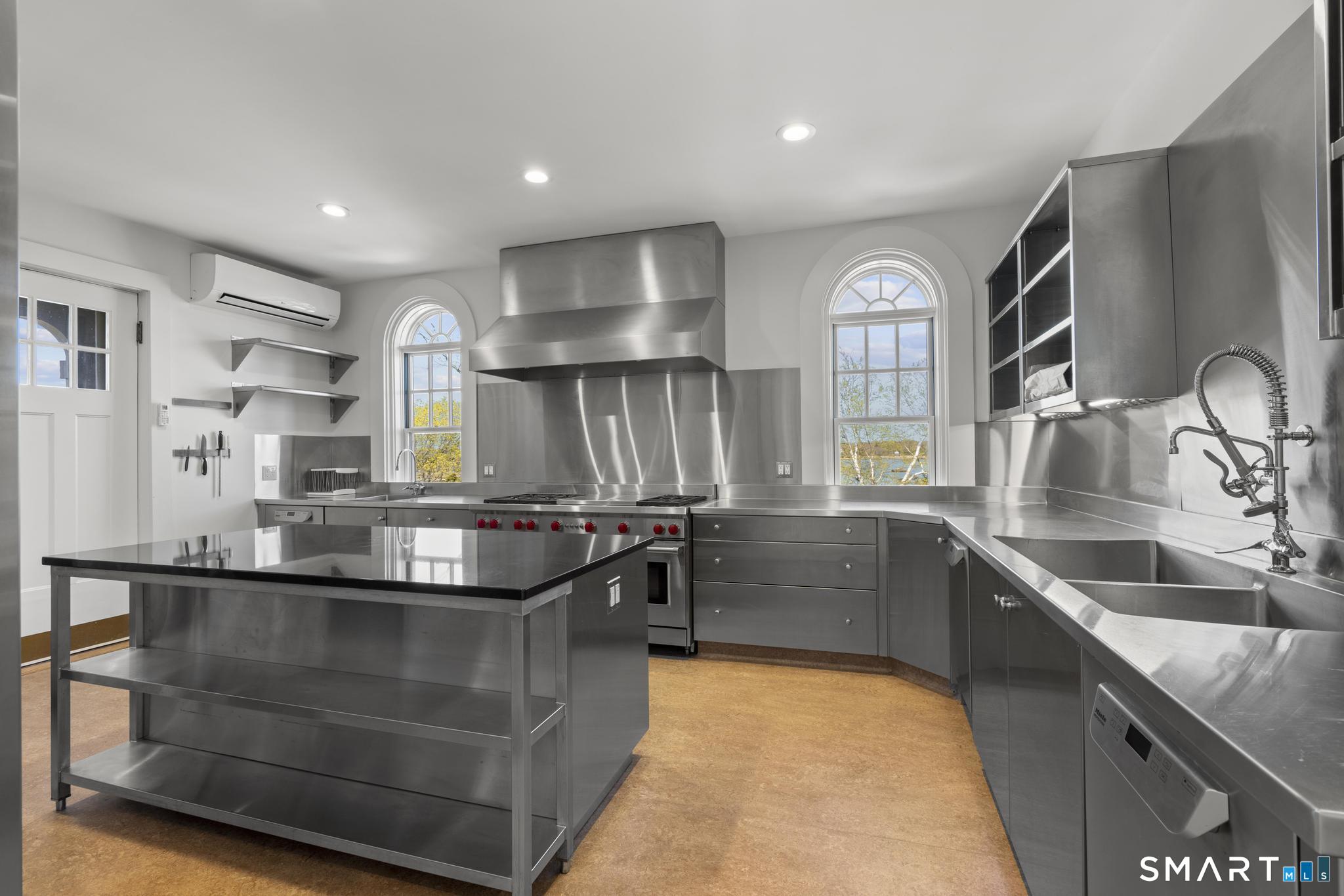 0 Rogers Island Branford, CT 06405 - Photo 11 of 40 a kitchen with stainless steel appliances granite countertop a sink and a stove