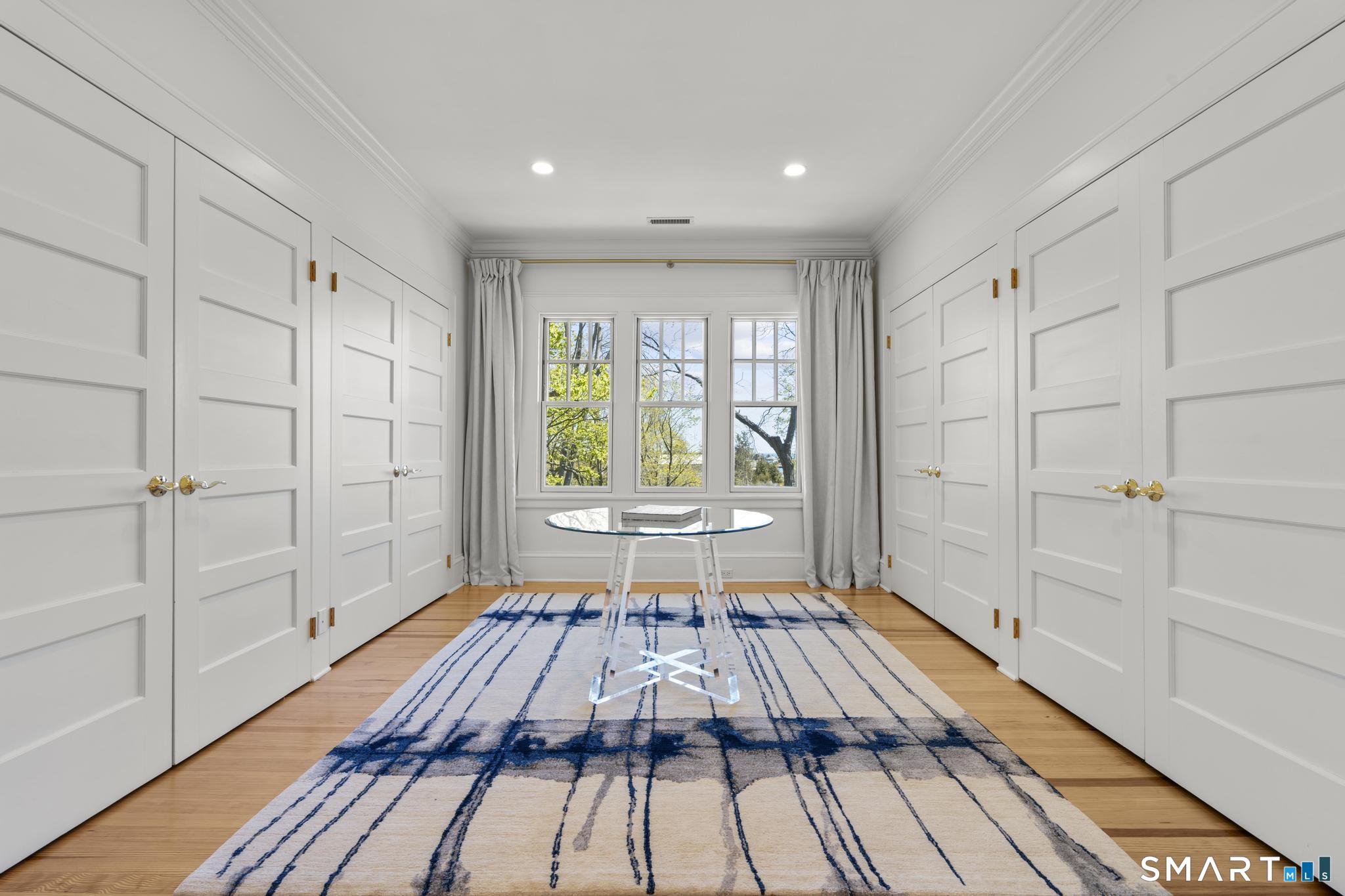 0 Rogers Island Branford, CT 06405 - Photo 14 of 40 a view of a room with wooden floor and glass door