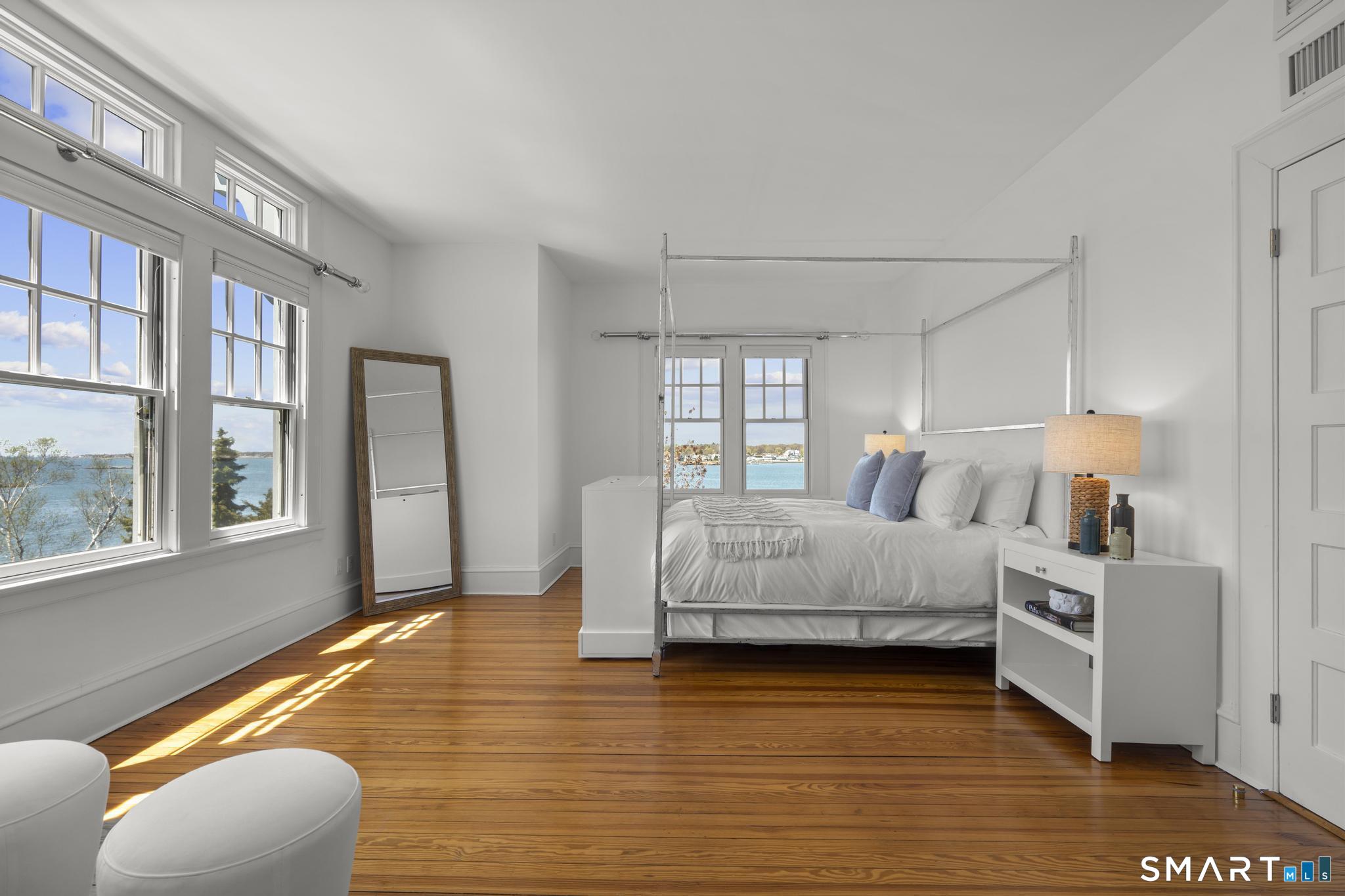 0 Rogers Island Branford, CT 06405 - Photo 17 of 40 a bedroom with a bed and a large window