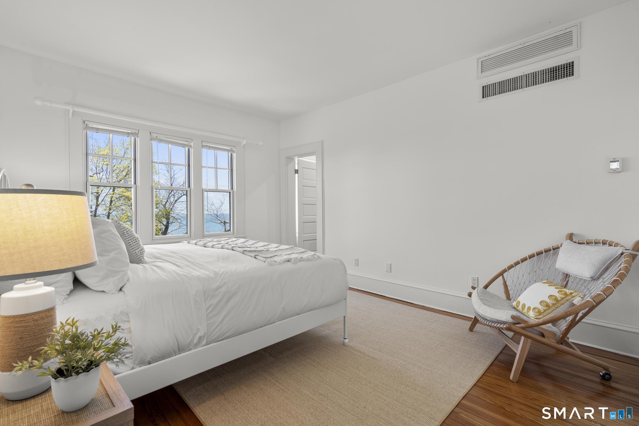 0 Rogers Island Branford, CT 06405 - Photo 18 of 40 a bedroom with a bed and chair