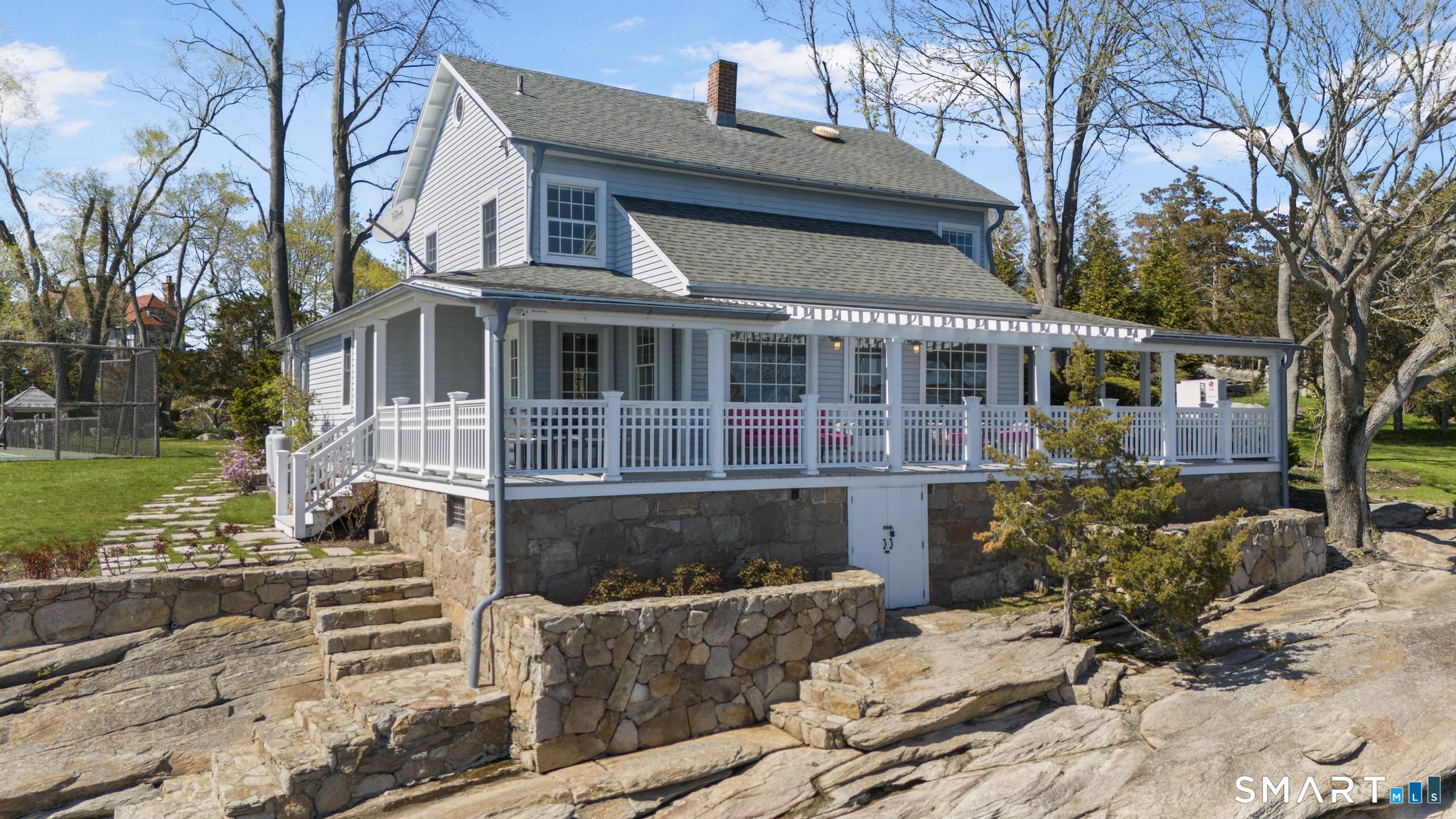 0 Rogers Island Branford, CT 06405 - Photo 26 of 40 a front view of a house with a yard