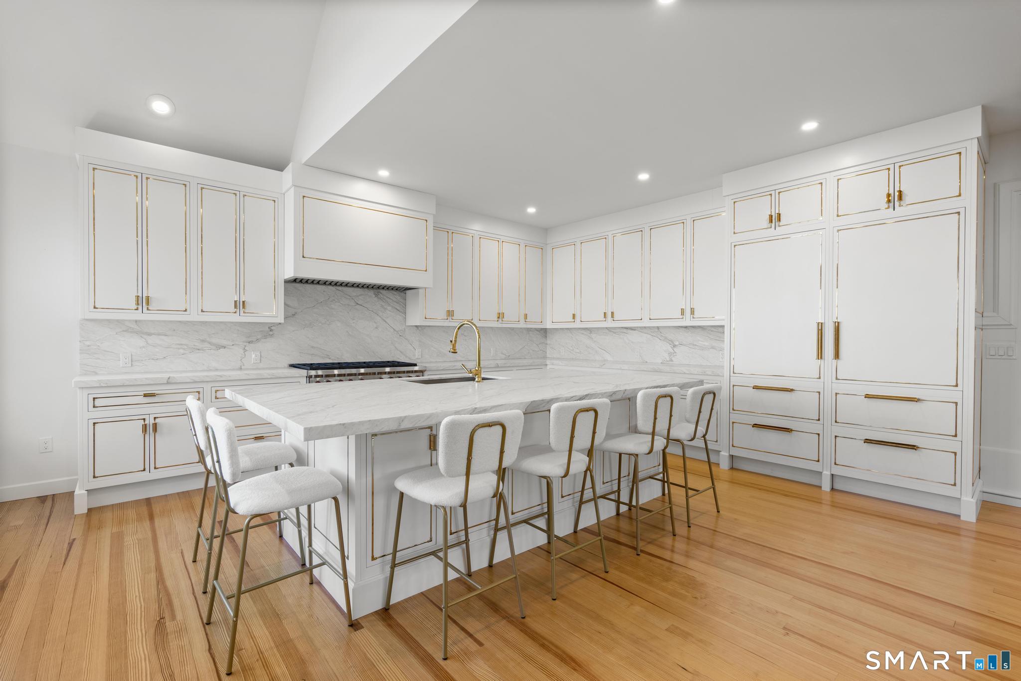0 Rogers Island Branford, CT 06405 - Photo 9 of 40 a kitchen with white cabinets and stainless steel appliances