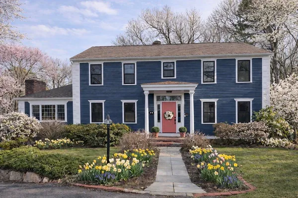 a front view of a house with garden