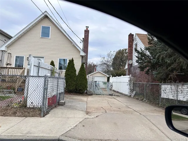 a view of a house with a fence