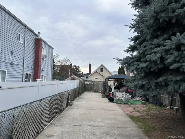 a view of a street with cars on city street