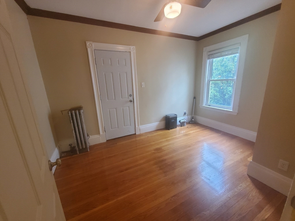 45 Intervale Street, Unit 2 Boston, MA 02121 - Photo 17 of 17 a view of empty room with wooden floor and fan