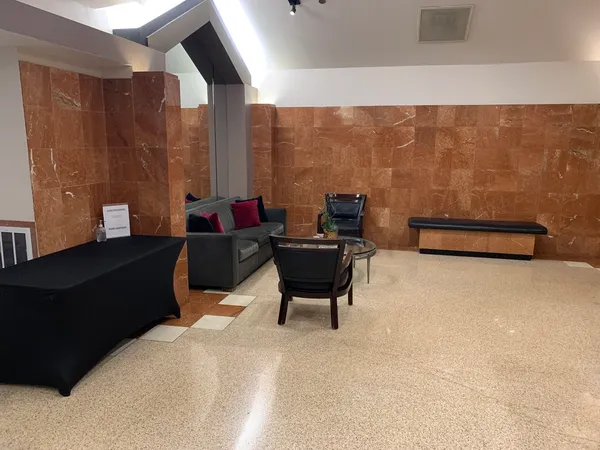 a living room with furniture and a large window