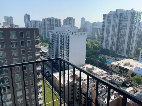 a view of a balcony with city