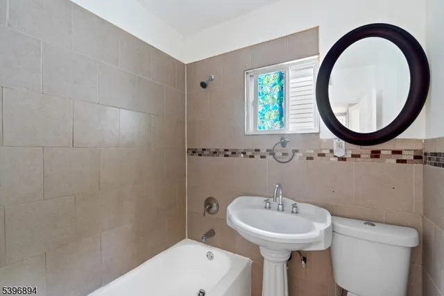 a view of a bathroom from a hallway