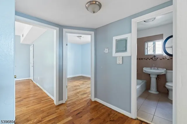 a kitchen with granite countertop a refrigerator and a sink