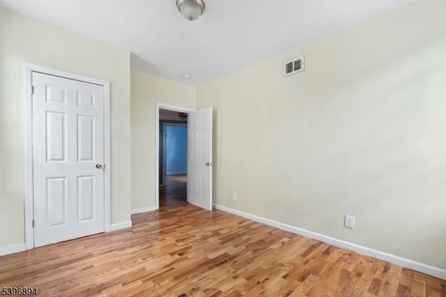 a front view of a residential apartment building with a yard