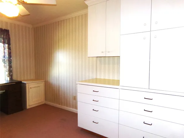 a view of a dresser and window