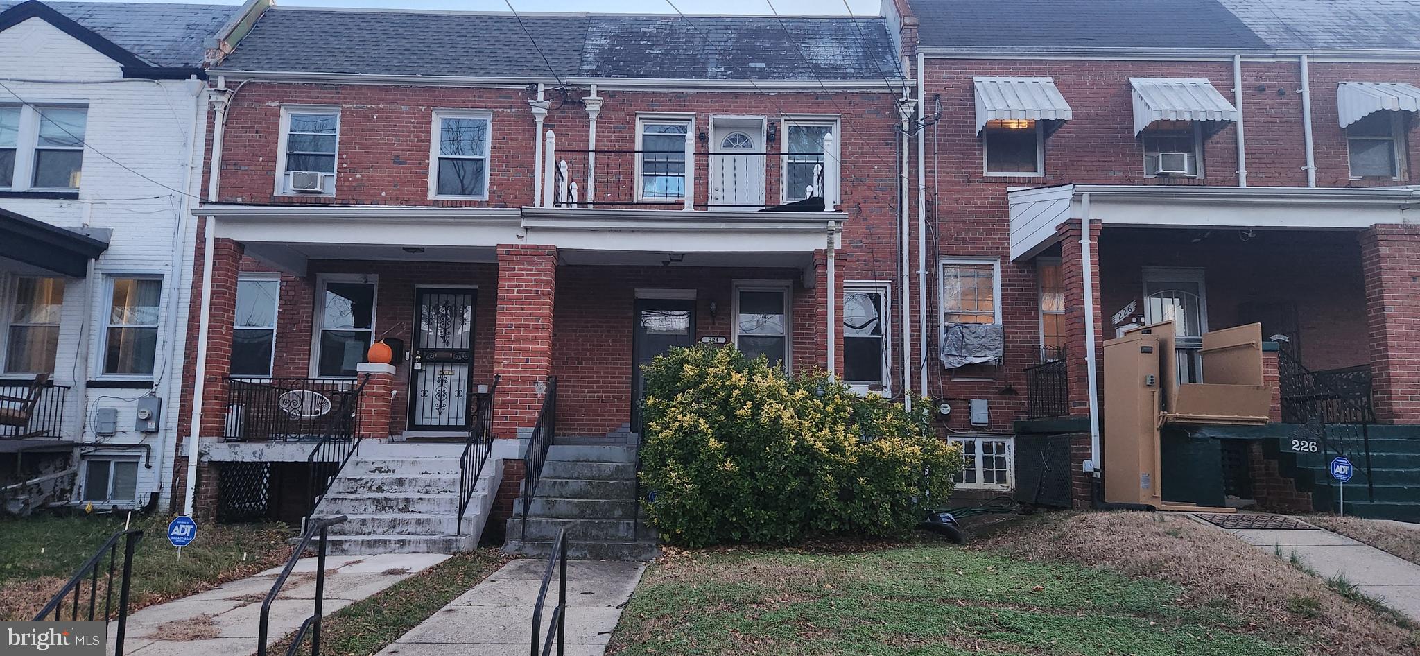 a front view of a brick building with many windows