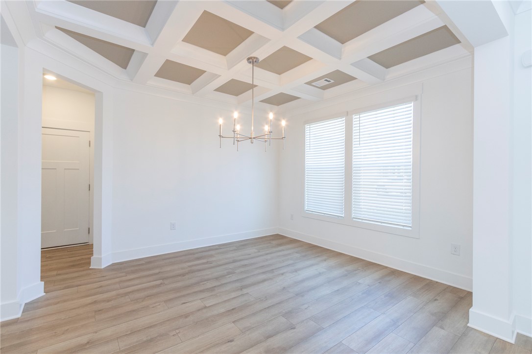 607 WH Kay Lane Anderson, SC 29621 - Photo 2 of 48 Artfully crafted coffered ceilings crown this versatile room with natural light.