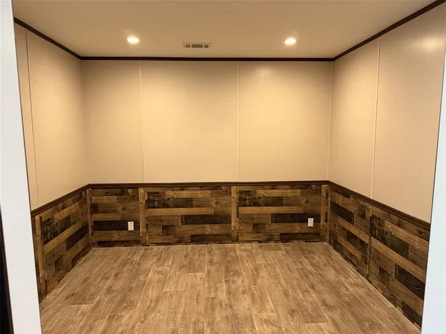 a bathroom with a granite countertop sink a mirror and vanity