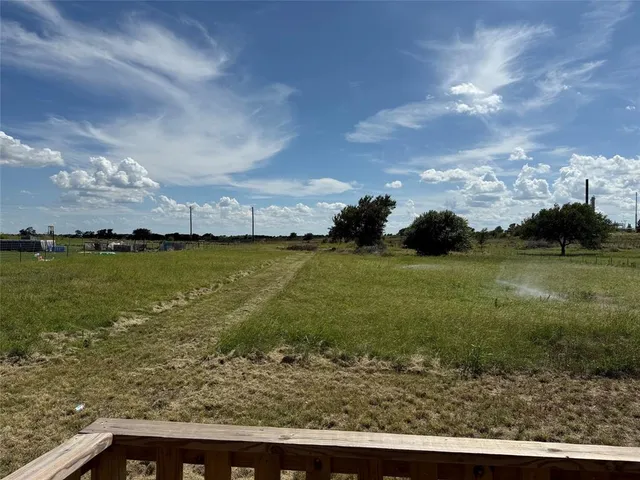 a large kitchen with stainless steel appliances granite countertop a refrigerator and a stove top oven