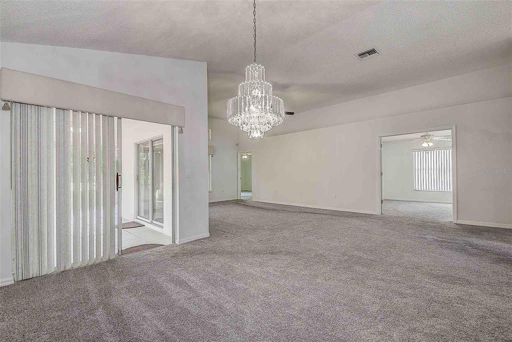 1020 Trafalgar Drive New Port Richey, FL 34655 - Photo 14 of 41 a view of a chandelier in big room and chandelier