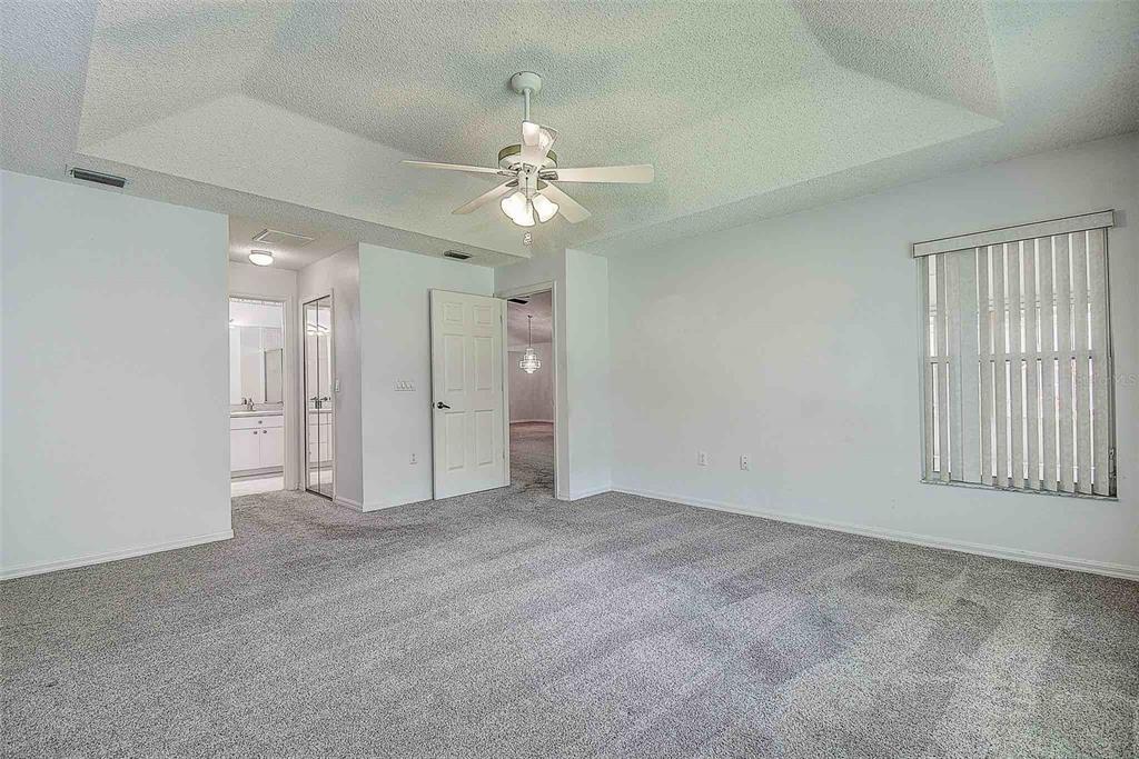 1020 Trafalgar Drive New Port Richey, FL 34655 - Photo 16 of 41 an empty room with fan and windows
