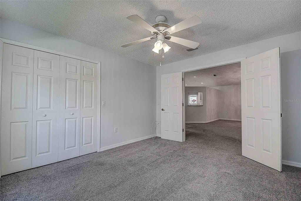 1020 Trafalgar Drive New Port Richey, FL 34655 - Photo 24 of 41 a view of an empty room and chandelier fan
