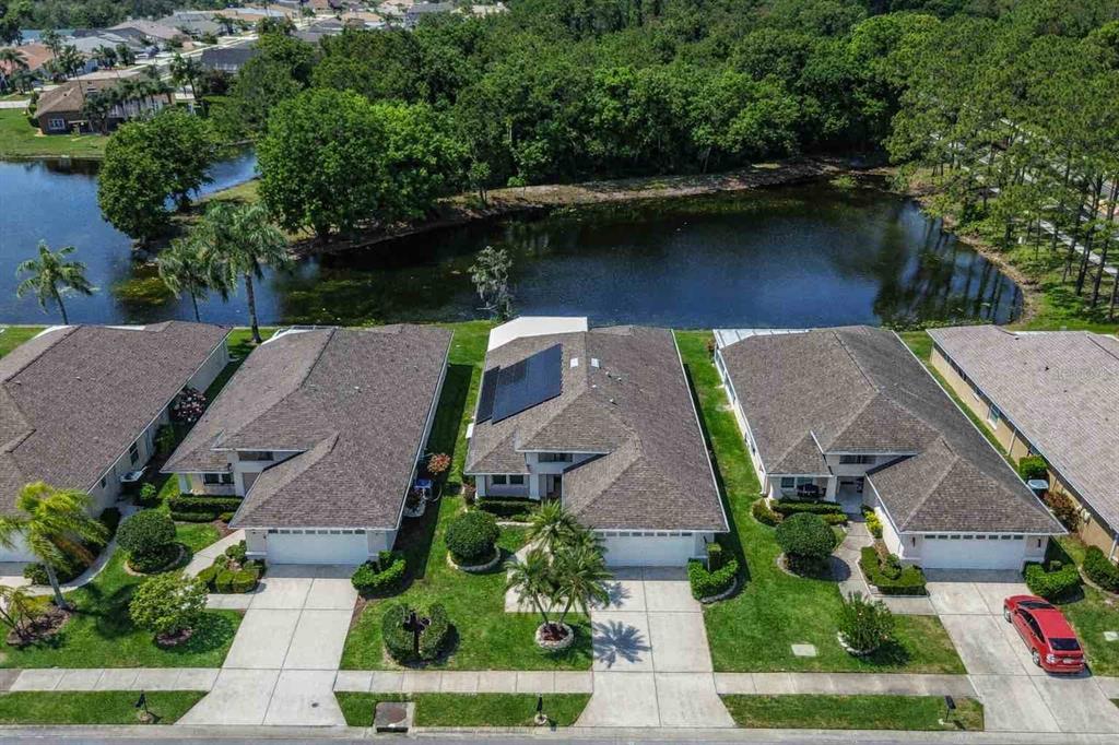 1020 Trafalgar Drive New Port Richey, FL 34655 - Photo 3 of 41 an aerial view of house with yard swimming pool and outdoor seating