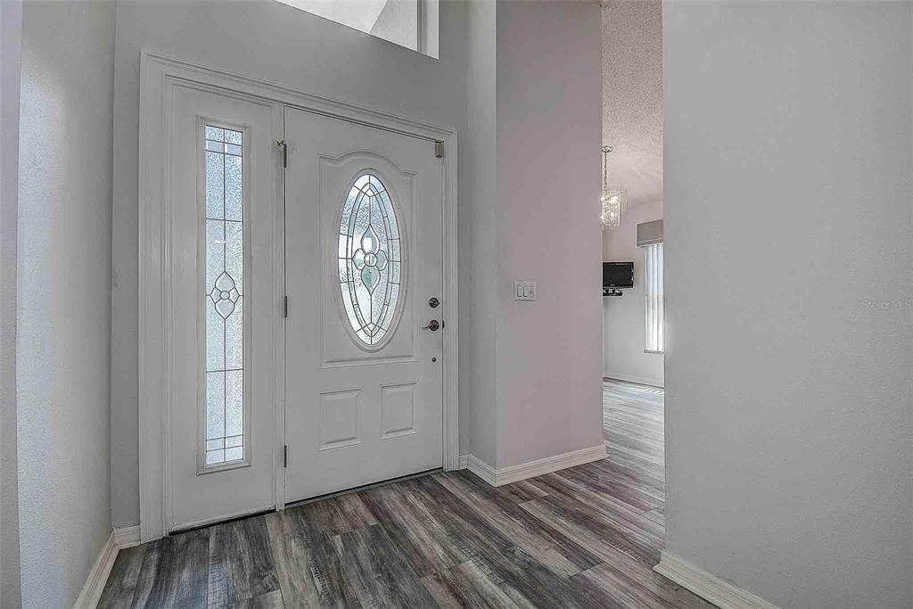 1020 Trafalgar Drive New Port Richey, FL 34655 - Photo 31 of 41 a view of a livingroom with wooden floor and white doors