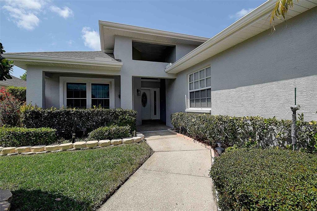 1020 Trafalgar Drive New Port Richey, FL 34655 - Photo 33 of 41 a front view of a house with a yard