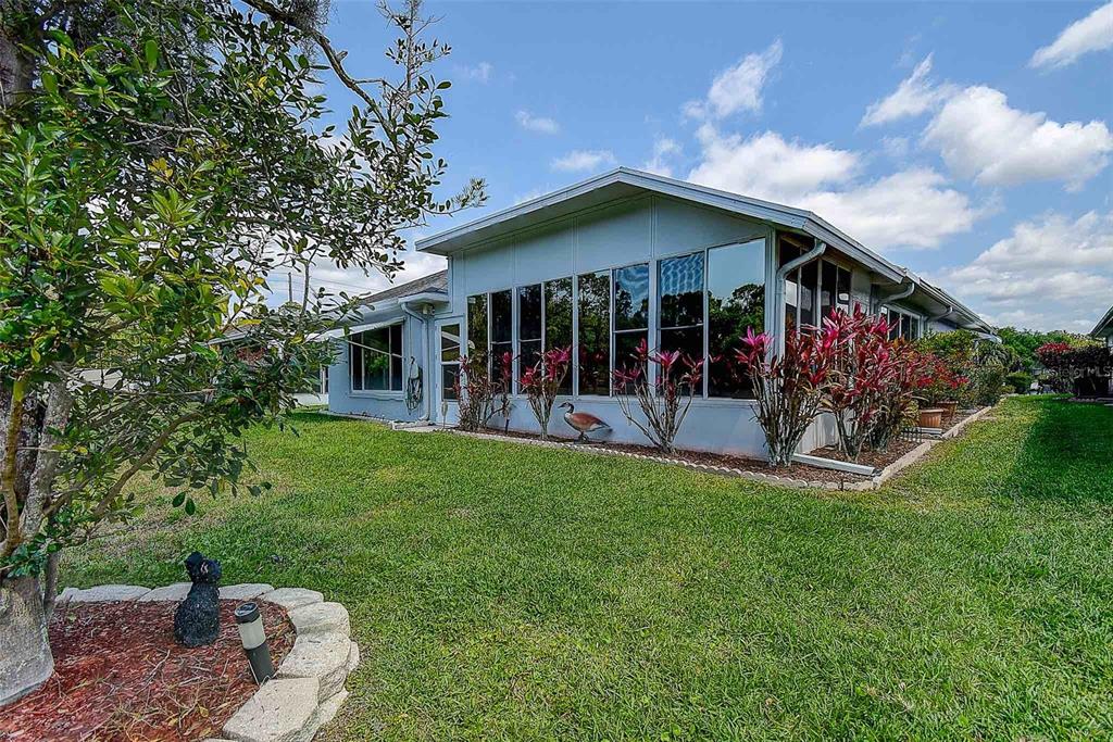 1020 Trafalgar Drive New Port Richey, FL 34655 - Photo 34 of 41 a view of a house with backyard porch and sitting area