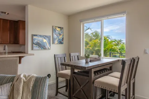a view of a dining room with furniture window and outside view