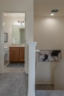 a bathroom with a sink and mirror