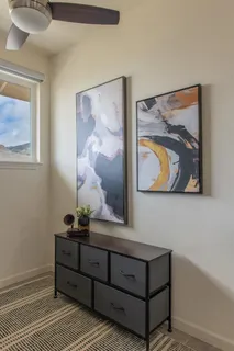 a room with painting on the wall and a painting on the wall