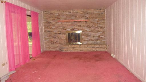 24760 Chestnut Lane Crete, IL 60417 - Photo 4 of 10 a view of a hallway with brick walls