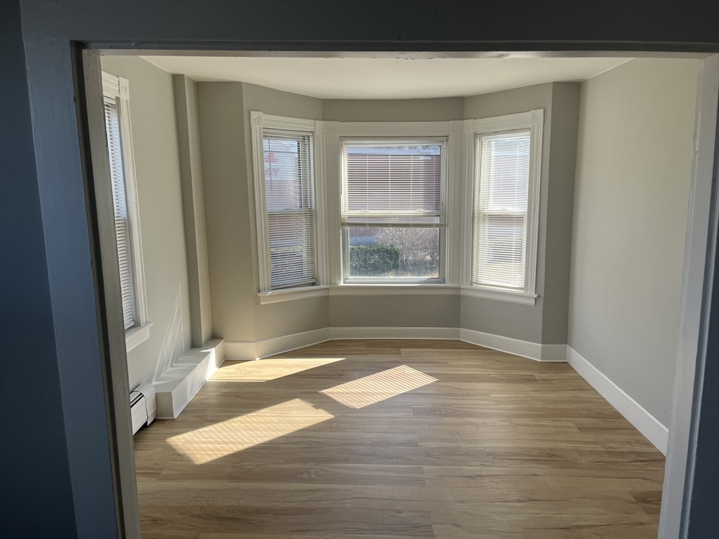 159 East Central Street, Unit 2 Franklin, MA 02038 - Photo 13 of 28 a view of an empty room and window