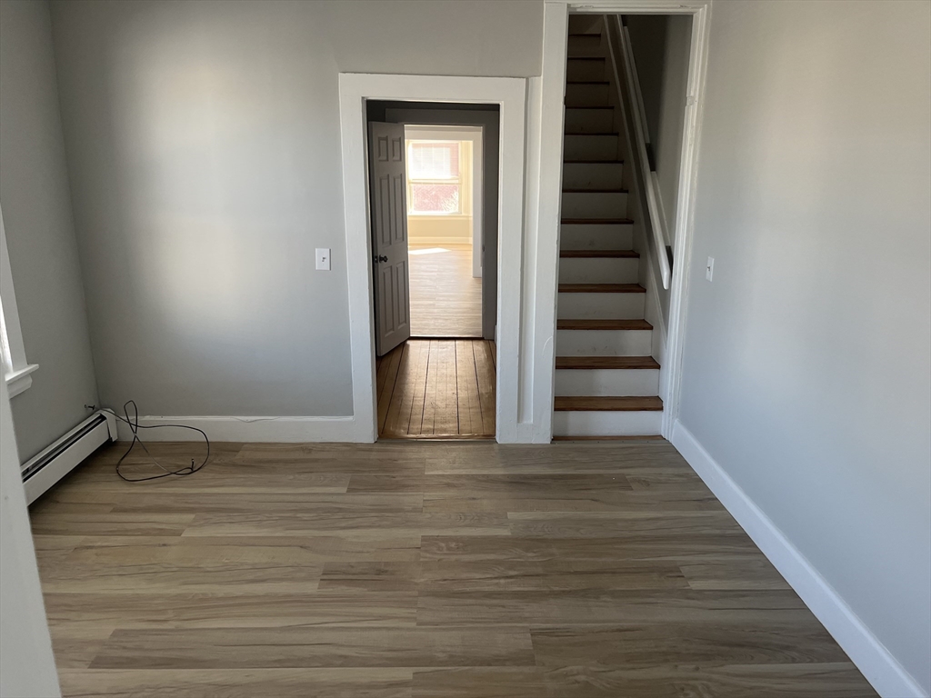 159 East Central Street, Unit 2 Franklin, MA 02038 - Photo 16 of 28 a view of a room with stairs and a window
