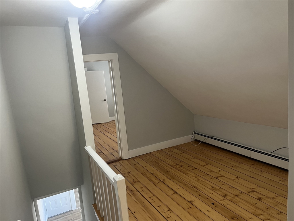 159 East Central Street, Unit 2 Franklin, MA 02038 - Photo 18 of 28 a view of a hallway with wooden floor