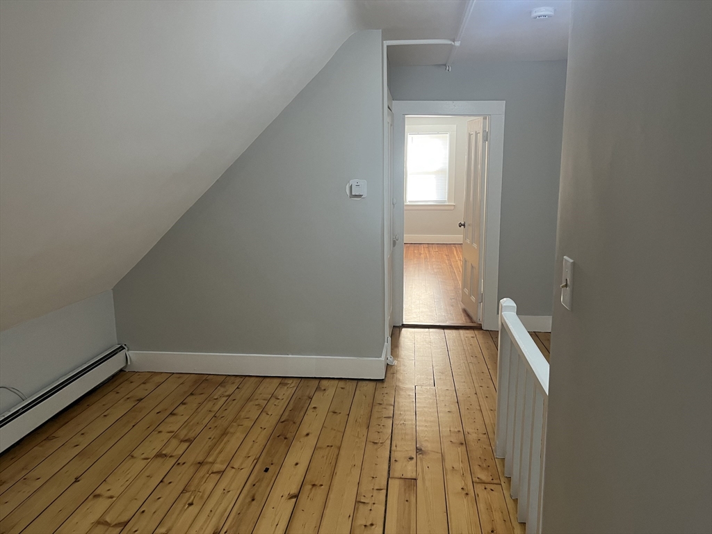 159 East Central Street, Unit 2 Franklin, MA 02038 - Photo 19 of 28 a view of empty room with wooden floor