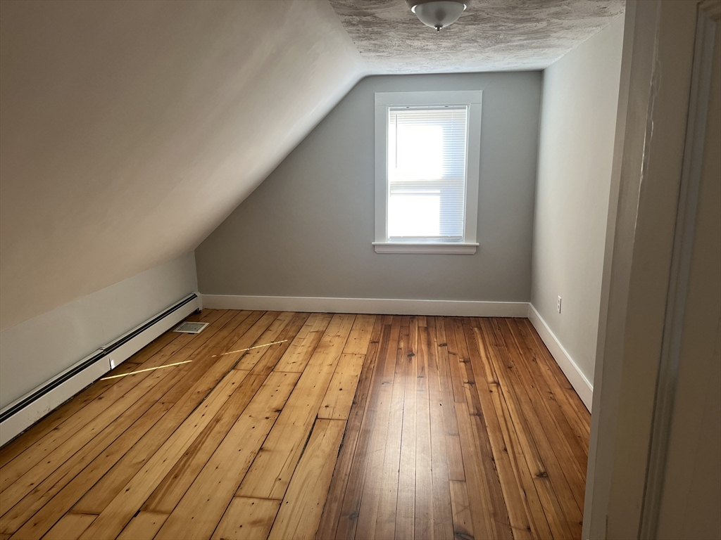159 East Central Street, Unit 2 Franklin, MA 02038 - Photo 20 of 28 a view of empty room with wooden floor