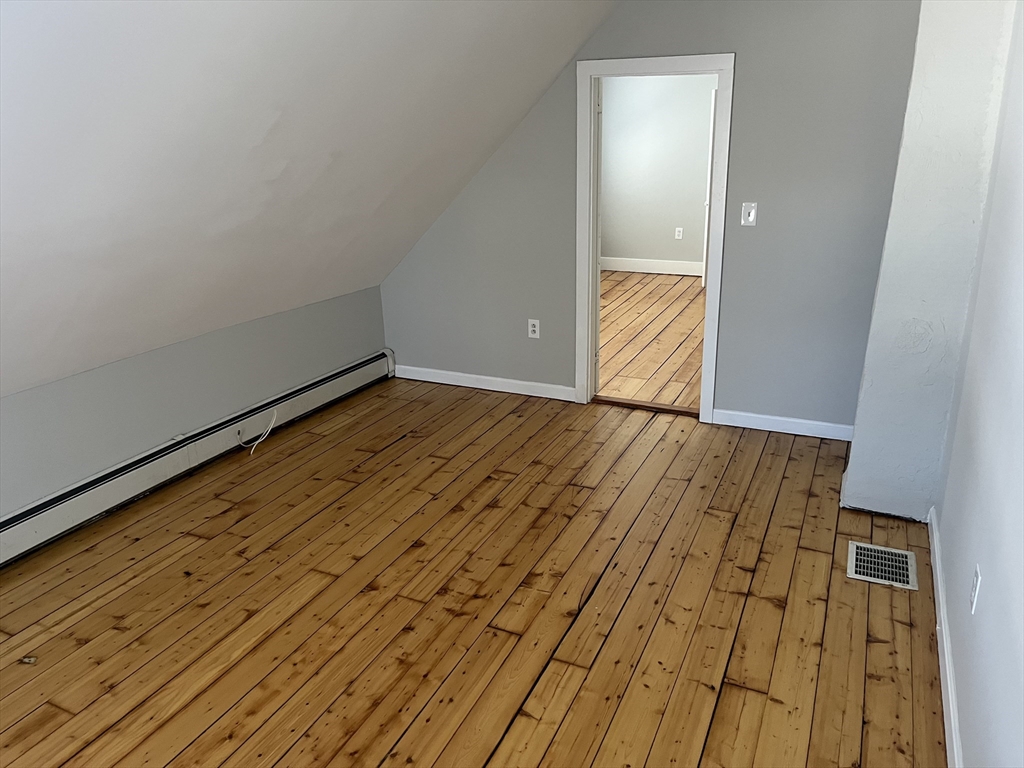 159 East Central Street, Unit 2 Franklin, MA 02038 - Photo 22 of 28 a view of hallway with wooden floor