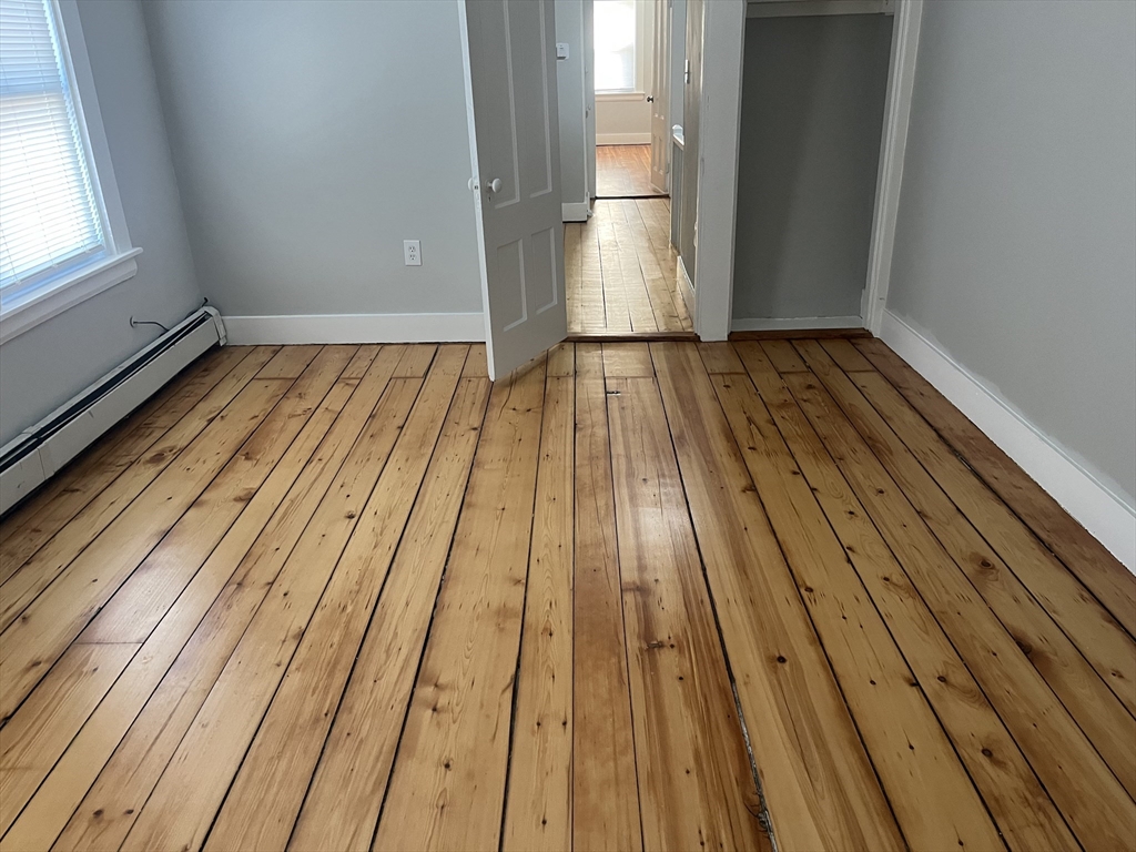 159 East Central Street, Unit 2 Franklin, MA 02038 - Photo 24 of 28 a view of wooden floor in a room