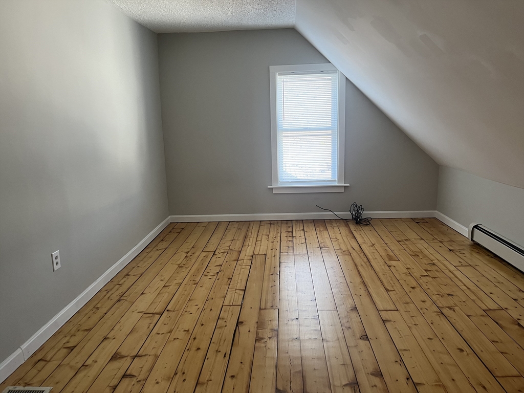 159 East Central Street, Unit 2 Franklin, MA 02038 - Photo 25 of 28 a view of empty room with wooden floor