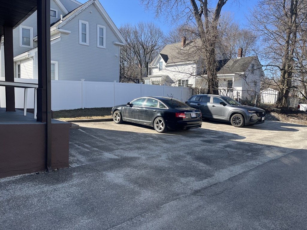 159 East Central Street, Unit 2 Franklin, MA 02038 - Photo 3 of 28 a view of street with parked cars